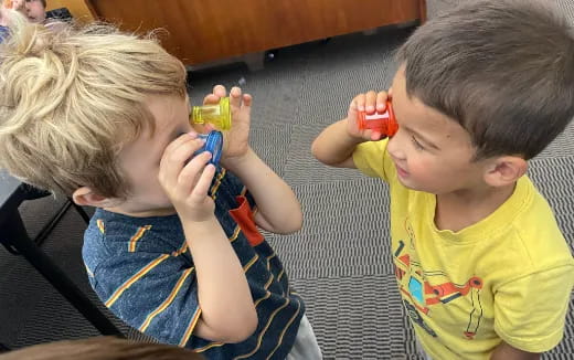 a couple of boys playing with toys