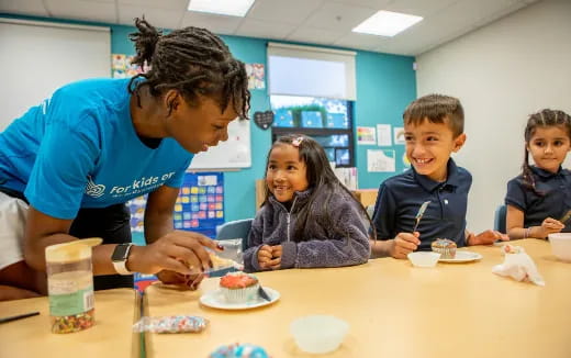 a person helping a group of kids