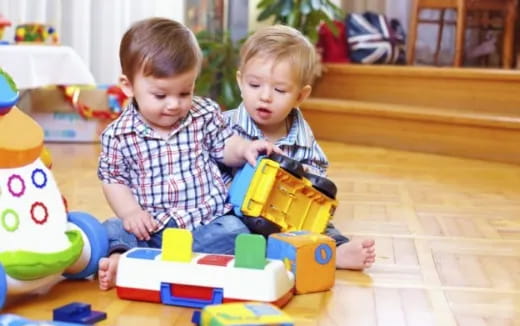 two children playing with toys