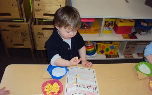 a child sitting at a table