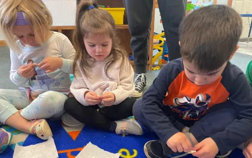 a group of children sitting on the floor