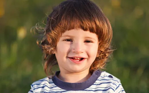 a close-up of a child smiling