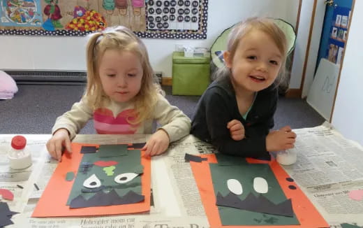 two children sitting at a table