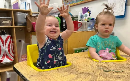 two children sitting at a table