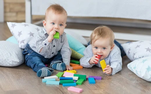 two babies playing with toys