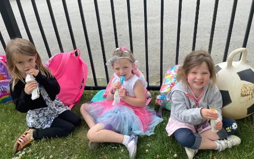 a group of girls eating ice cream