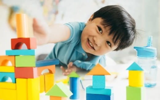 a child playing with blocks