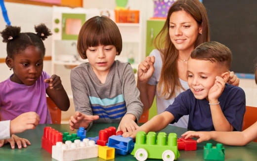 a group of children playing with toys