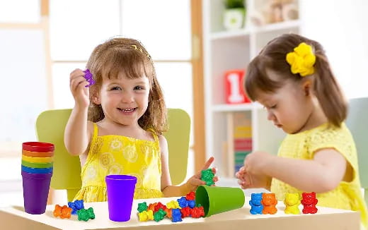 a couple of girls playing with toys