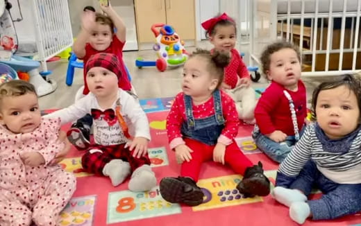 a group of children sitting on the floor