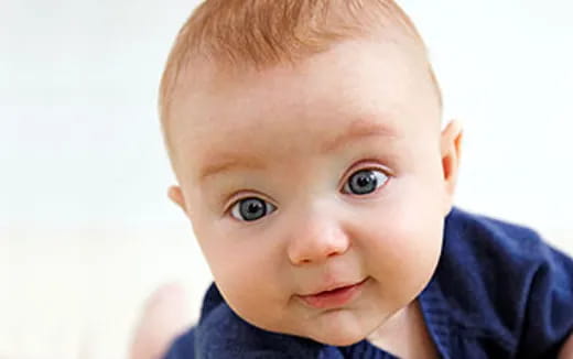 a baby looking at the camera