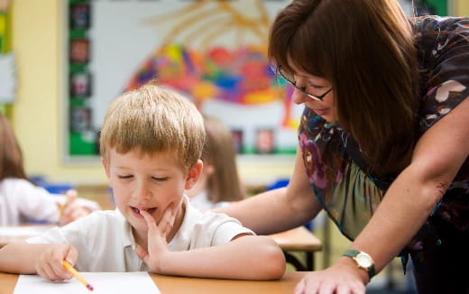 a person and a boy sitting at a table