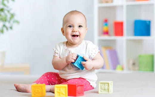 a baby sitting on a table