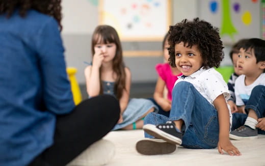 a group of children sitting on the floor