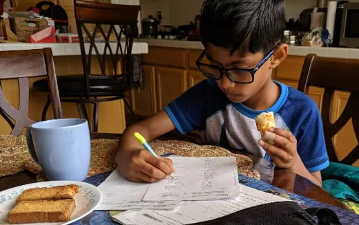 a boy eating a sandwich