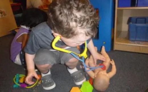 a few children playing with toys