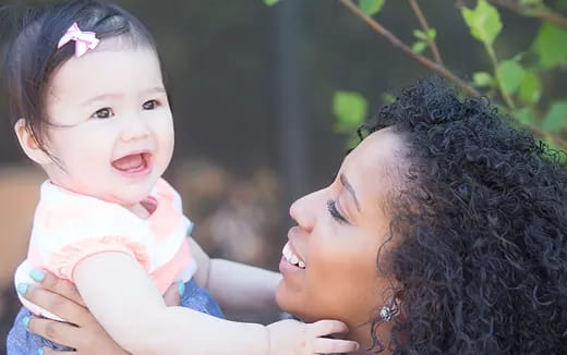 a person holding a baby