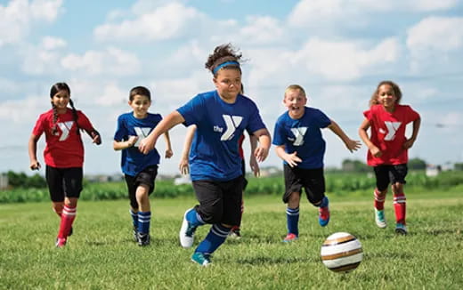 a group of kids playing football