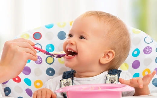 a baby with a toothbrush