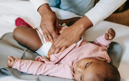 a baby being examined by doctors