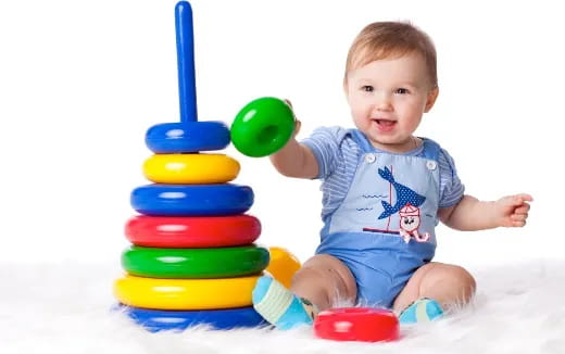 a baby playing with toys