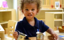 a child sitting at a table