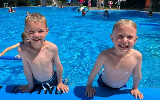 two boys in a pool