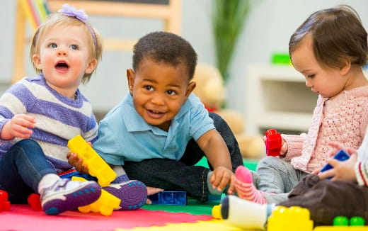 a group of children playing with toys