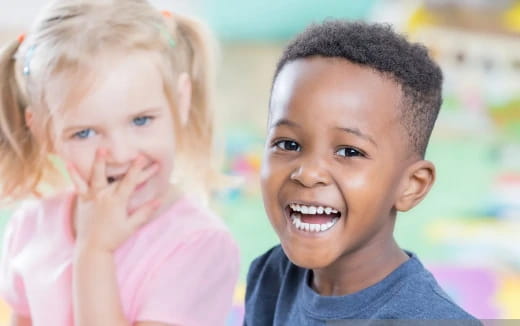 a boy and girl smiling