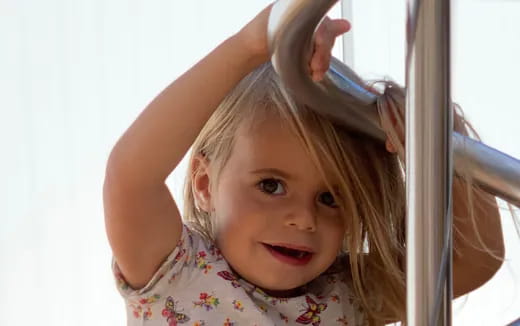 a little girl with her hair in a ponytail