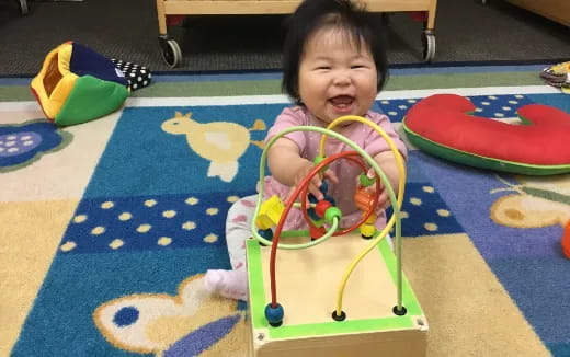 a baby in a toy car