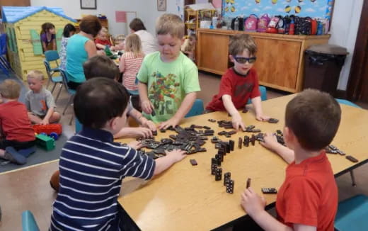 a group of children playing a board game