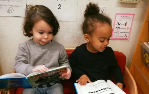 a few children reading a book