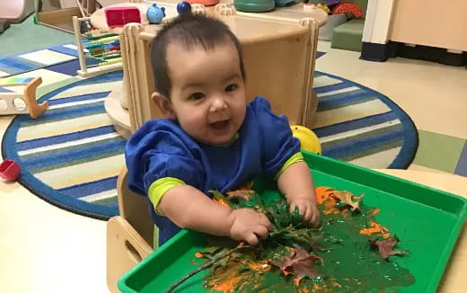 a baby sitting at a table