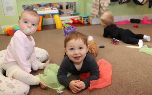 a group of children sitting on the floor