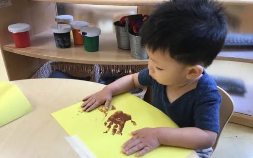 a child sitting at a table