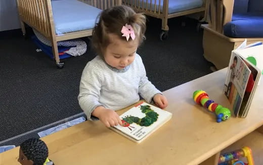 a girl sitting at a table