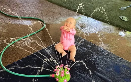 a doll sitting on a chair