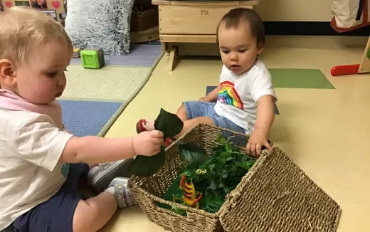 a couple of young boys playing with a toy