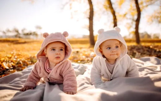 two babies wearing hats