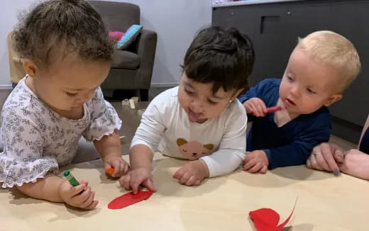 a group of children playing with toys