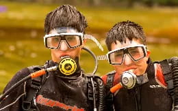 a couple of men wearing vr goggles and looking at the camera