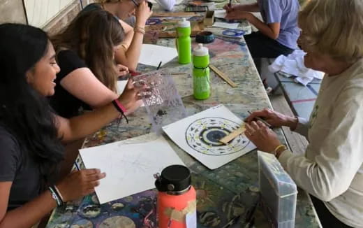 a group of people painting