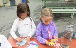 a few young girls painting