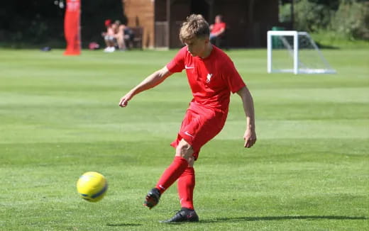 a person kicking a football ball