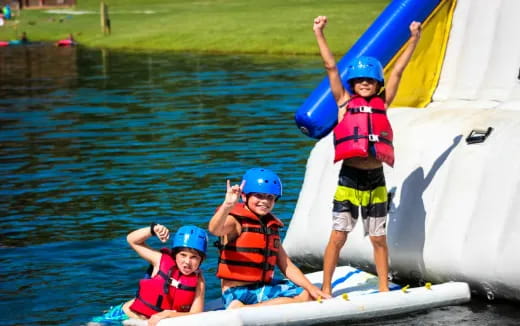 a group of kids on a boat