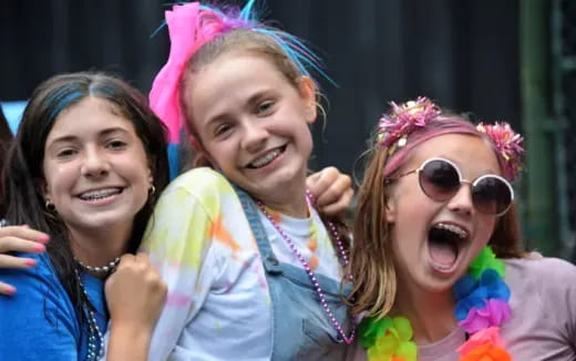 a group of girls with pink hair