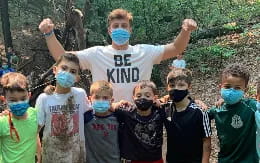 a group of children with face masks