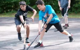 a group of people playing roller hockey