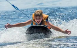 a man riding a inner tube